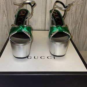 GUCCI
Metallic Calfskin Crystal Knotted Strap Crawford Platform Sandals